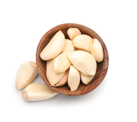 Wooden bowl with fresh garlic cloves on white background