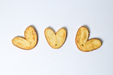 Top view of three mini pies isolated on white background. Clipping path. Love sign. High angle, above. Close up. Butter. Danish.