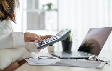 Human use calculator and calculate bills and paying bill, credit card, tax and vat, payment,...