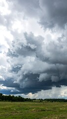 Dramatic storm clouds over a field