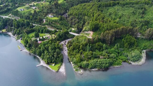 Aerial drone view of the shoreline of Lake Ranco, southern Chile &ndash; forested coast, houses, and tranquil blue water