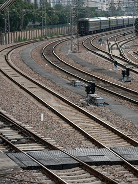 Gravel and straight cross-rails curve into the distance