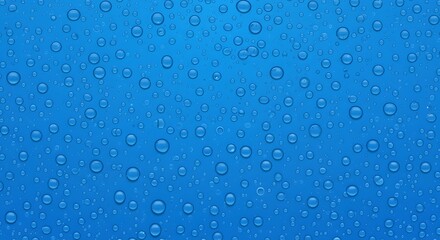 Water Droplets on Blue: Delicate water droplets adorn a vibrant blue surface, creating a captivating play of light and texture. This image evokes feelings of freshness and serenity.