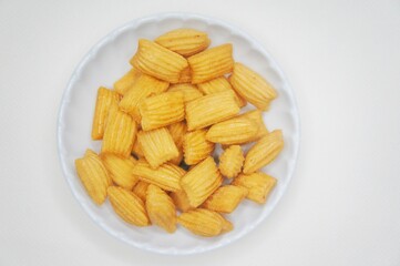 Pang-Pang Cake or Pillow Cake, a typical Indonesian sweet snack placed on a small plate.