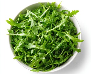 Fresh arugula salad in white bowl
