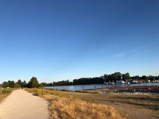 Tugboat on the River at Golden Hour – River District, South Vancouver Waterfront Scene

