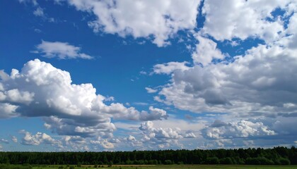 Scenic landscape featuring fluffy clouds across a vibrant blue sky creating picturesque nature view
