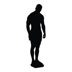 Silhouette of a man standing on a scale