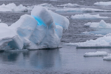 Blue light reflections in the arctic ice north of Svalbard, Norway © Reto Ammann