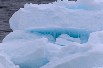 Icicle and blue light reflections in the arctic ice north of Svalbard, Norway © Reto Ammann