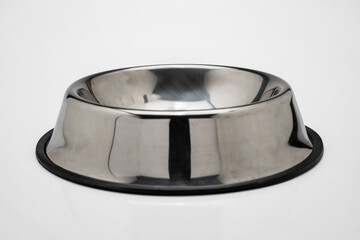 Empty stainless steel bowl tray for pet food isolated over a white background