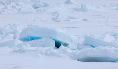 Blue light reflections in the arctic ice north of Svalbard, Norway © Reto Ammann
