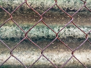 Naklejka premium colorful corrugated roof fence, with rusty netting