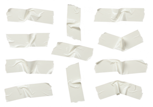 Several pieces of wrinkled white adhesive tape scattered and isolated on a transparent background