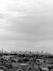 Obraz premium view from the parking lot showing tall buildings in the distance, black and white photo