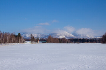 Winter ranch and the mountains of Shikaribetsu