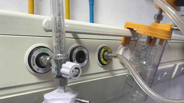 Closeup of hospital room outlets for medical gases like oxygen and vacuum, The panel is designed to provide a safe and efficient way to deliver these services to patients at their bedside
