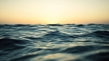 Tranquil ocean view with calm waves under golden sunset, minimalist seascape with copy space, conveying peace, relaxation and freedom of coastal life.
