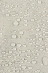 water drops on the white fabric, vertical