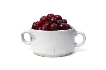 There is a pile of ripe juicy cherries on the plate.