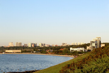 Fototapeta premium The city is visible from afar on the river bank. 