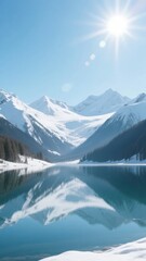 Fototapeta premium Snow-Capped Mountains Reflecting in a Calm Lake Under a Bright Sun