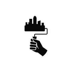 Hand holding paint roller creating city skyline silhouette isolated on white background