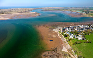 Fototapeta premium Ravenglass fishing village and site of Roman port of Itunocelum on mouth of River Esk on W coast of Cumbria. View to NW