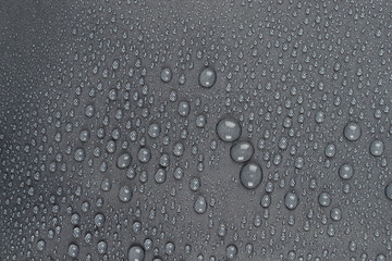 Water drops on the dark gray  fabric, horizontal