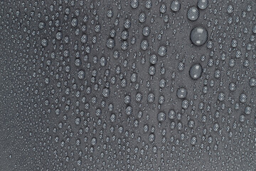 Water drops on the dark gray  fabric, horizontal