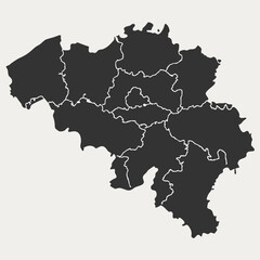 Obraz premium A dark silhouette map of Belgium, divided into its administrative regions, presented against a light neutral background.