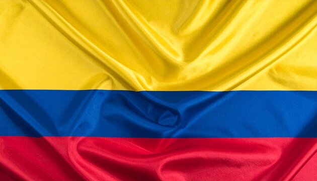 Colombia national flag with three horizontal stripes—yellow (top, half of flag), blue (middle), and red (bottom)—symbolizing wealth, seas, and bloodshed for independence; textile folds convey pride.