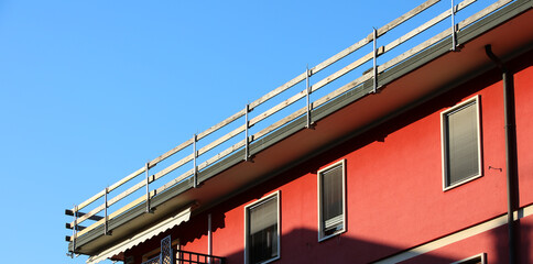 installed safety barrier for workers safety to prevent falls during maintenance work on the roof of the condominium without people
