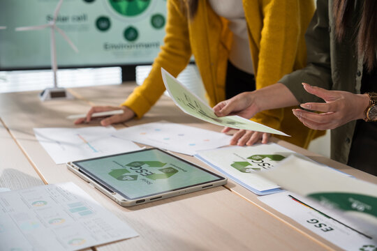 Asian business leaders meet to strategize on implementing sustainable practices, focusing on reuse, recycling, and environmental protection for a greener future