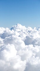 Fluffy clouds against a clear sky