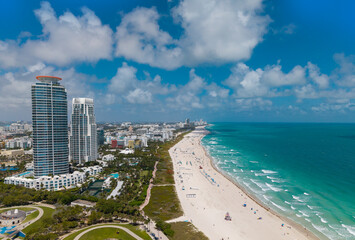 Naklejka premium Miami Beach aerial view with skyline. Miami from above. Miamis famous landmarks. South Pointe beach with skyscrapers. Miami city panorama. Skyline of Miami Beach with blue sky.