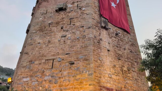 Iconic view of the Red Tower (Kızıl Kule), a 13th-century Seljuk structure located in the coastal city of Alanya, Turkey.