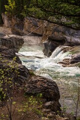 Obraz premium Water Cascading Through A Rocky Canyon