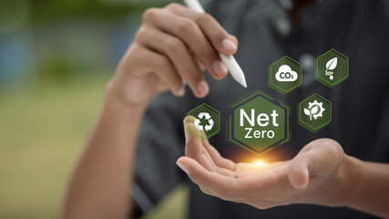 Holding net zero digital icon with green sustainability symbols