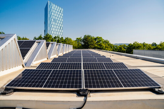 Solar panels on the roof of a building under blue sky