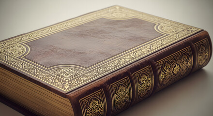 Fototapeta premium An elegant antique book with a brown leather cover featuring ornate gold tooling on the spine and cover.