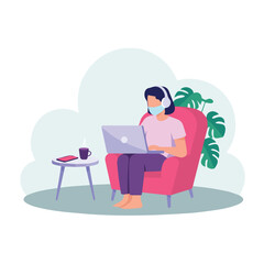 Woman with mask and headphones using laptop in armchair with table and plant behind her indoors scene