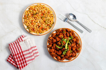 Soya Manchurian served with fried rice is a delicious, protein-rich Indo-Chinese combo featuring spicy soya chunks and aromatic, flavorful vegetable fried rice.
