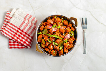 Chilli soyabean is a spicy, tangy Indo-Chinese dish made with crispy soyabean chunks stir-fried in flavorful sauces, peppers, garlic, and spring onions.
