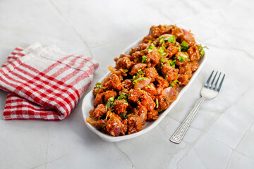 Chilli soyabean is a spicy, tangy Indo-Chinese dish made with crispy soyabean chunks stir-fried in flavorful sauces, peppers, garlic, and spring onions.
