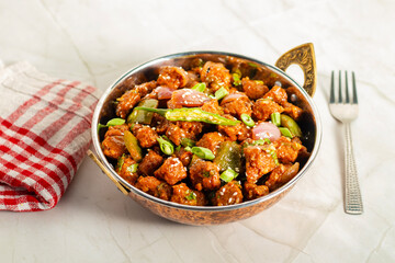 Chilli soyabean is a spicy, tangy Indo-Chinese dish made with crispy soyabean chunks stir-fried in flavorful sauces, peppers, garlic, and spring onions.
