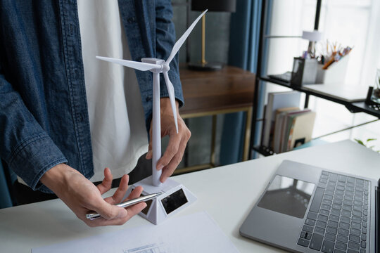 Engineer Design green energy technology with solar panel and wind turbine