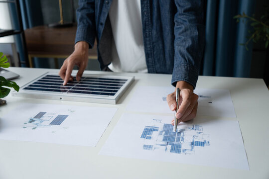 Engineer Design green energy technology with solar panel and wind turbine