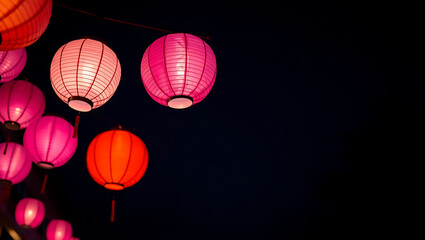 Colorful Japanese paper lanterns glowing at night during the Obon Festival, capturing the beauty of traditional Asian culture, celebration, and festive decorative lighting.
