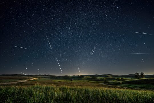 Night sky filled with shooting stars over a tranquil landscape - Powered by Adobe